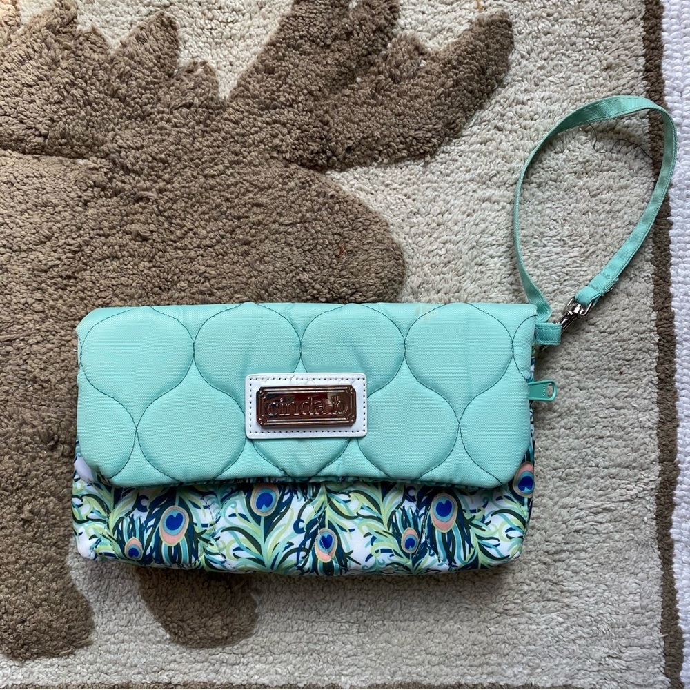 Cinda B Fold-over Wristlet in Purely Peacock
